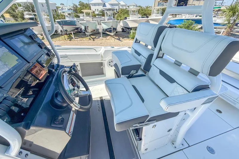 Slide: The Image of 2023 Blackfin 302 CC boat cockpit with modern controls and comfortable seating. - 28