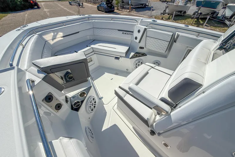 Slide: The Image of 2023 Blackfin 302 CC boat interior with luxurious seating and modern amenities. - 37