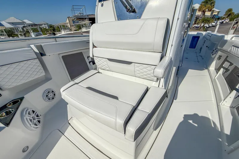 Slide: The Image of 2023 Blackfin 302 CC boat interior with white cushioned seating and modern design. - 42