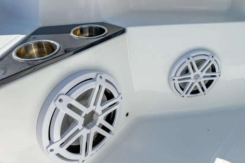 Slide: The Image of 2023 Blackfin 302 CC boat speakers and cup holders on deck. - 43