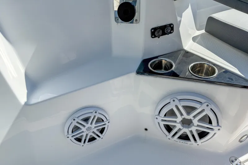 Slide: The Image of 2023 Blackfin 302 CC boat interior with speakers and cup holders. - 46