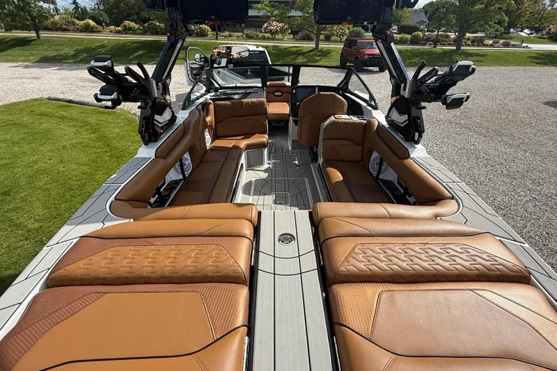 Slide: The Image of Luxurious interior of 2026 Centurion Ri245 boat with tan leather seating and modern design. - 18