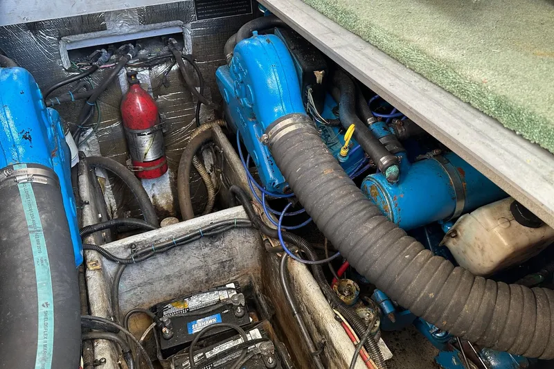Slide: The Image of Engine compartment of a 1992 Mainship 35 Convertible with visible components and wiring. - 13