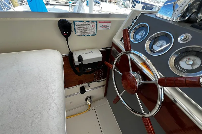Slide: The Image of 1967 Chris-Craft 31 Commander helm with vintage gauges and Garmin device. - 11