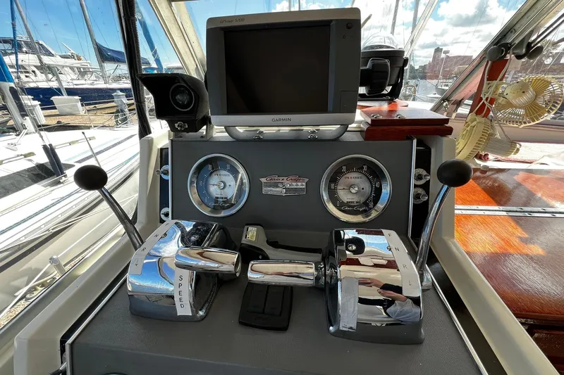 Slide: The Image of Helm of 1967 Chris-Craft 31 Commander with gauges, controls, and Garmin GPS. - 13