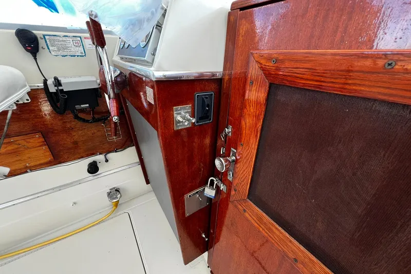 Slide: The Image of Interior of 1967 Chris-Craft 31 Commander with wooden paneling and control equipment. - 14