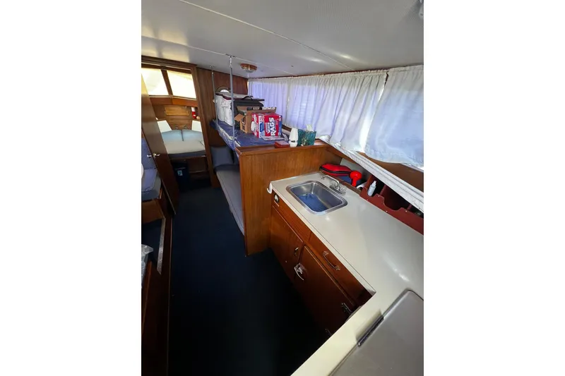 Slide: The Image of 1967 Chris-Craft 31 Commander interior with kitchenette and sleeping area. - 21