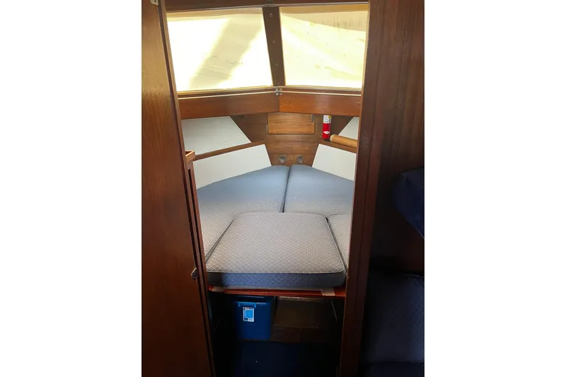 Slide: The Image of 1967 Chris-Craft 31 Commander cabin interior with cushions and wooden finish. - 23