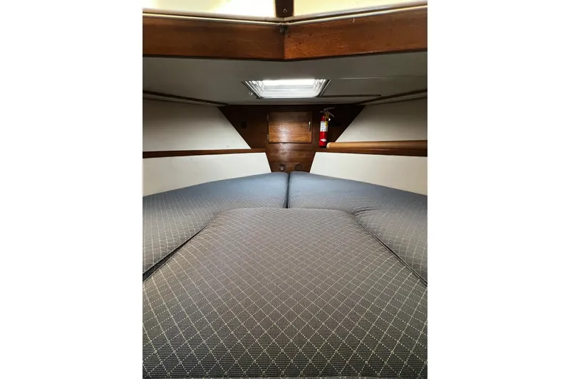 Slide: The Image of Interior cabin of 1967 Chris-Craft 31 Commander with cozy bedding and wooden accents. - 25