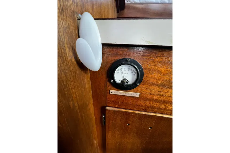 Slide: The Image of 1967 Chris-Craft 31 Commander interior with voltmeter on wooden panel. - 29