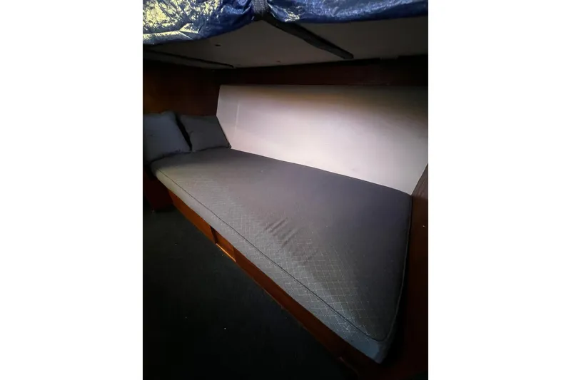 Slide: The Image of Interior cabin of 1967 Chris-Craft 31 Commander with a cozy bed setup. - 31