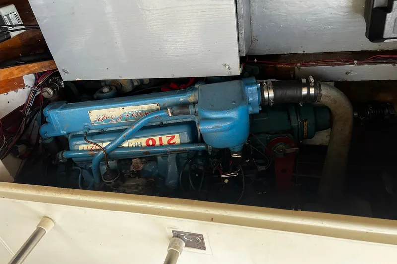 Slide: The Image of 1967 Chris-Craft 31 Commander engine compartment with visible blue engine components. - 38