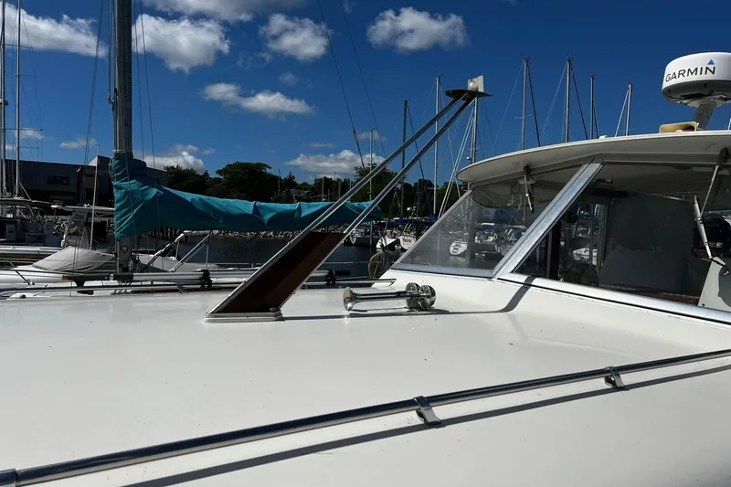 Slide: The Image of 1967 Chris-Craft 31 Commander boat docked at marina under blue sky. - 4