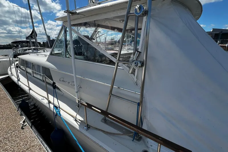 Slide: The Image of 1967 Chris-Craft 31 Commander docked, showcasing classic design and sleek lines. - 6