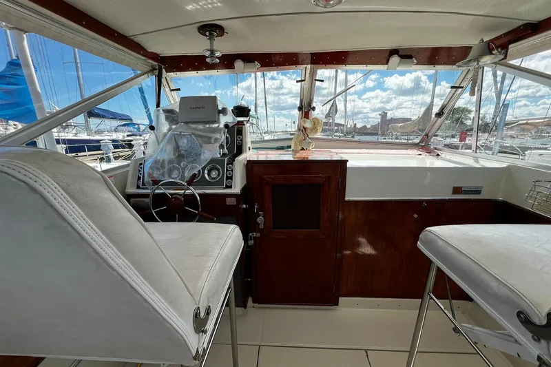 Slide: The Image of 1967 Chris-Craft 31 Commander boat interior with helm, seats, and navigation equipment. - 8