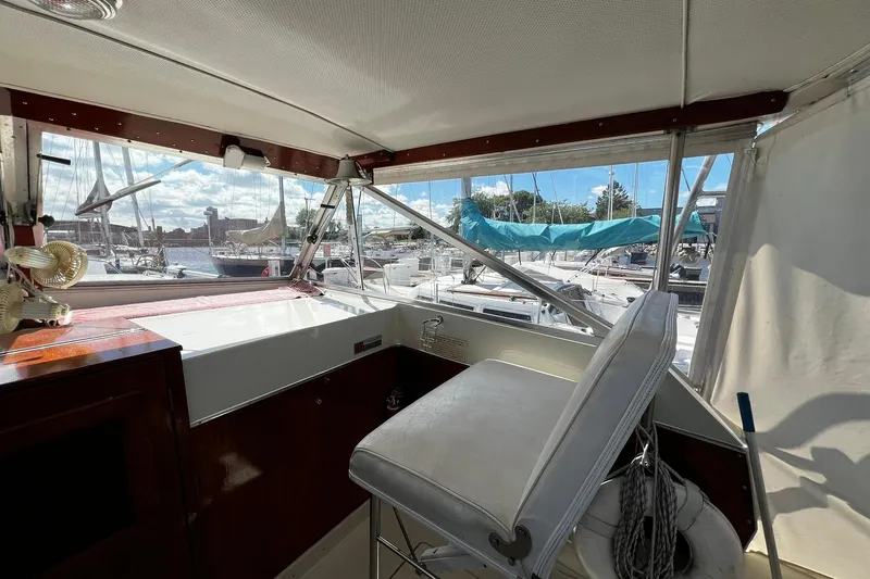 Slide: The Image of Interior view of a 1967 Chris-Craft 31 Commander boat at a marina. - 9