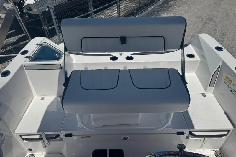 Slide: The Image of 2026 Yamaha Boats 220 FSH Sport interior seating and deck area. - 13