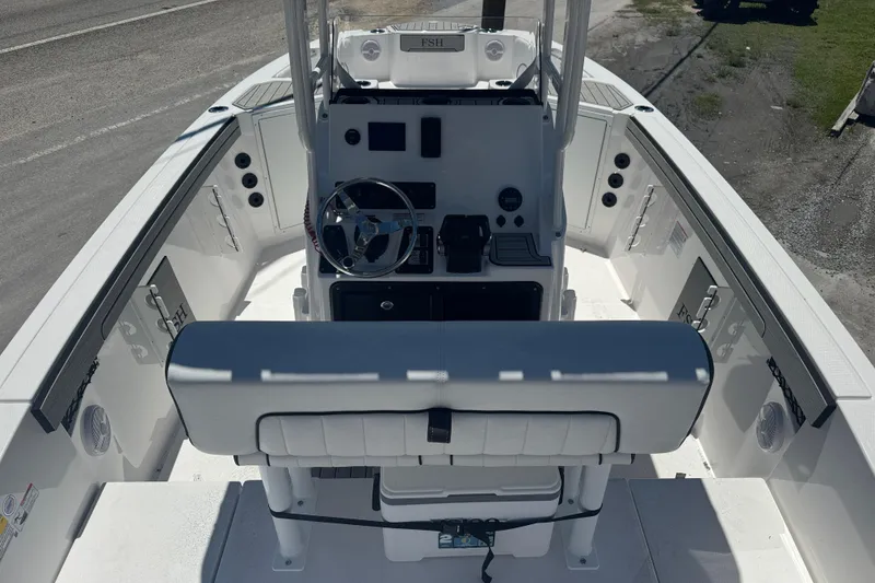 Slide: The Image of 2026 Yamaha Boats 220 FSH Sport interior, featuring helm and seating area. - 4