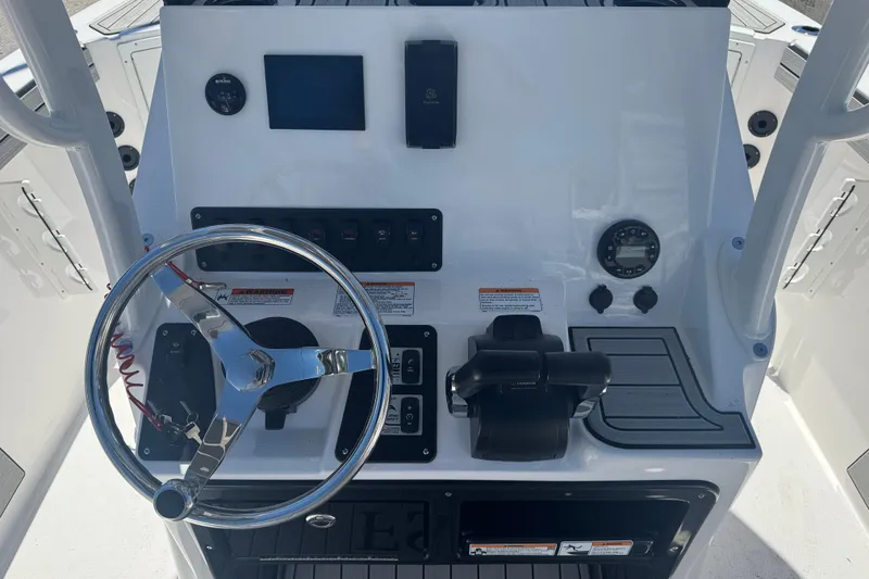 Slide: The Image of 2026 Yamaha Boats 220 FSH Sport dashboard with steering wheel and controls. - 6