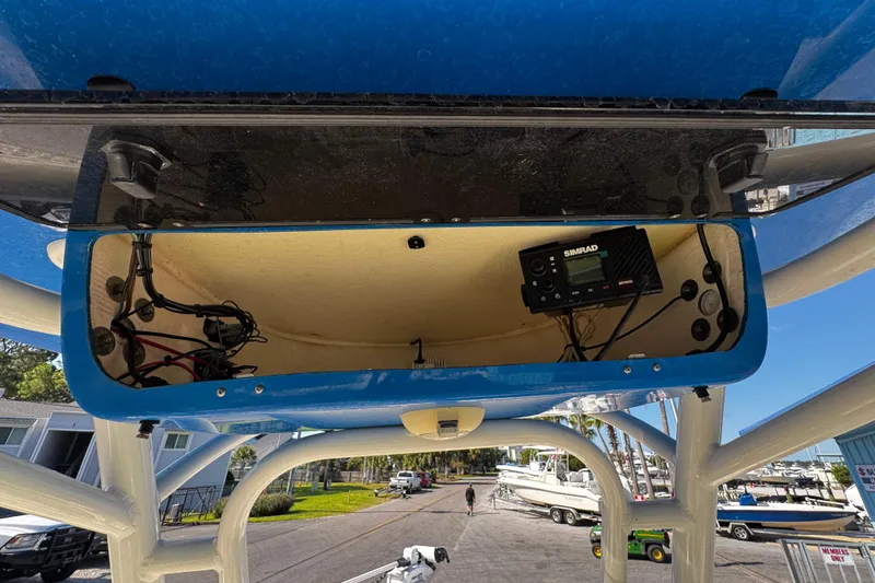 Slide: The Image of 2018 Key West 239 FS boat electronics compartment with Simrad equipment. - 16