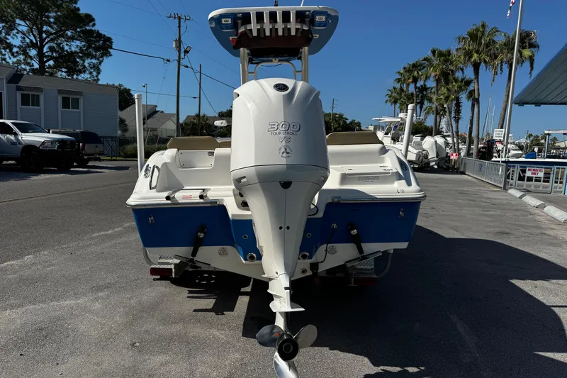 Slide: The Image of 2018 Key West 239 FS boat with 300 horsepower engine, parked on a sunny day. - 6