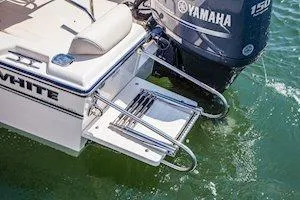 Slide: The Image of 2026 Grady-White Fisherman 180 boat with Yamaha engine, featuring a swim platform and ladder. - 10