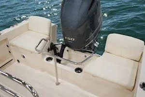 Slide: The Image of 2026 Grady-White Fisherman 180 boat interior with seating and outboard motor on water. - 11