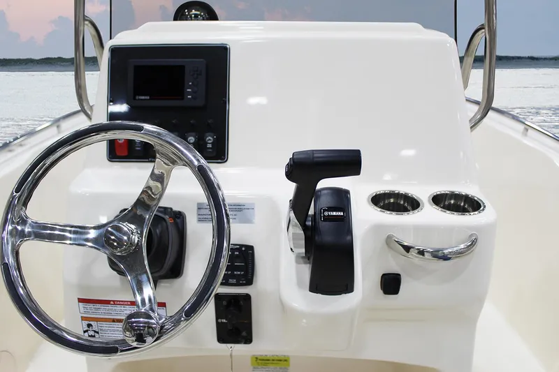 Slide: The Image of 2026 Grady-White Fisherman 180 boat bow with storage compartment, on calm water. - 4