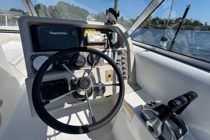 Slide: The Image of Steering console of 2000 World Cat 246 DC boat with Raymarine equipment. - 10