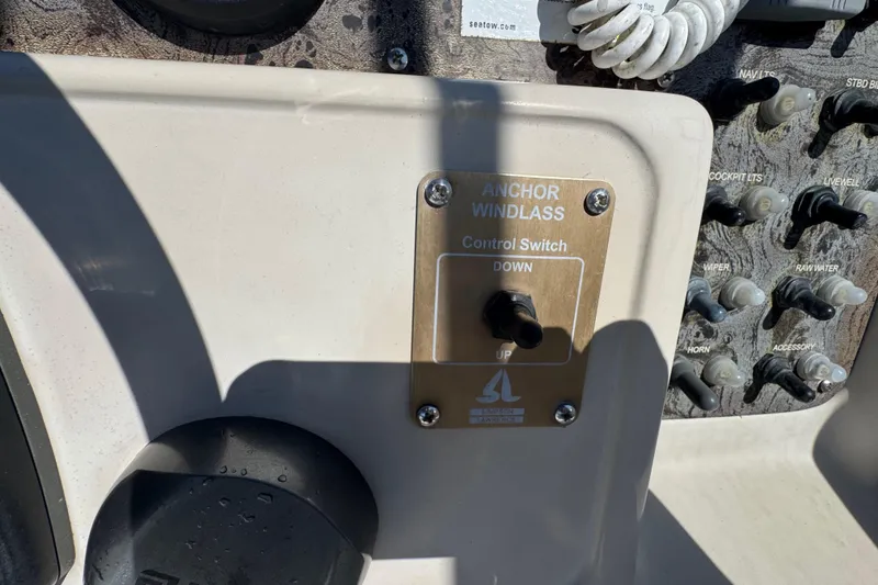 Slide: The Image of Control panel of a 2000 World Cat 246 DC boat with anchor windlass switch. - 9