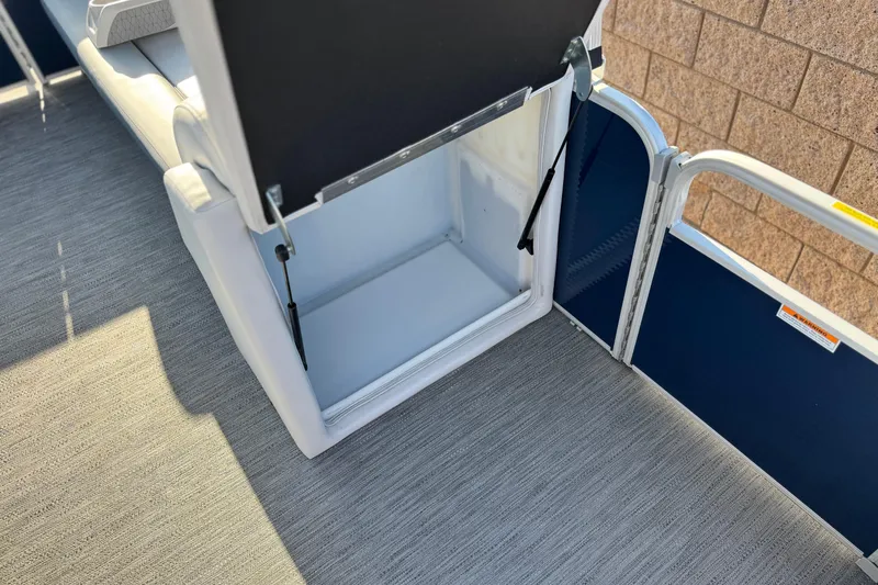 Slide: The Image of 2022 Godfrey SWEETWATER 2086 boat interior storage compartment with open seat. - 14