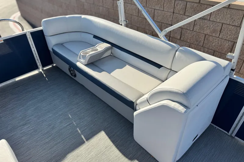 Slide: The Image of 2022 Godfrey SWEETWATER 2086 boat interior with cushioned seating and cup holder. - 15