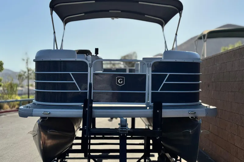 Slide: The Image of 2022 Godfrey SWEETWATER 2086 pontoon boat, rear view, parked outdoors. - 2