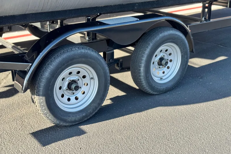 Slide: The Image of Trailer wheels of 2022 Godfrey SWEETWATER 2086 on asphalt surface. - 25