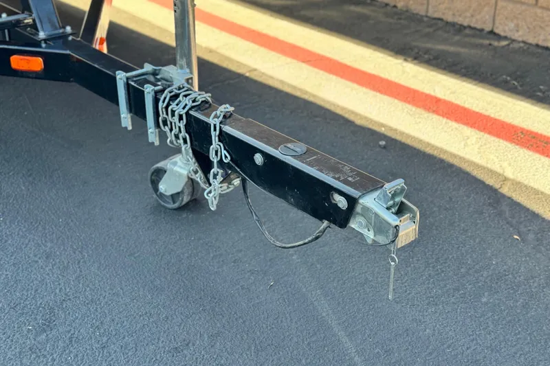 Slide: The Image of Trailer hitch with chains on a 2022 Godfrey SWEETWATER 2086 boat trailer. - 26