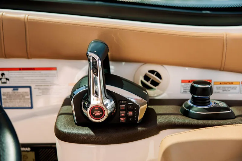 Slide: The Image of 2022 Sea Ray Sundancer 320 Outboard control panel with joystick and throttle. - 11