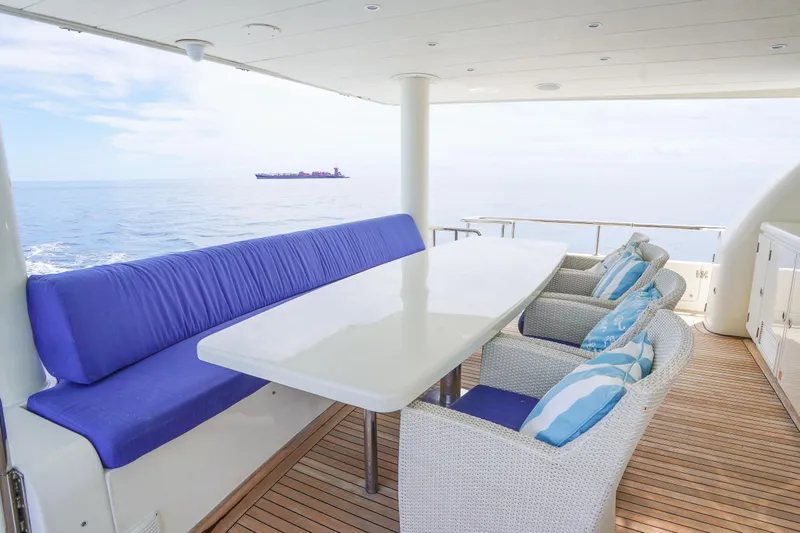 Slide: The Image of Luxury yacht Monte Fino 82MY 2001, featuring elegant outdoor seating with ocean view. - 10