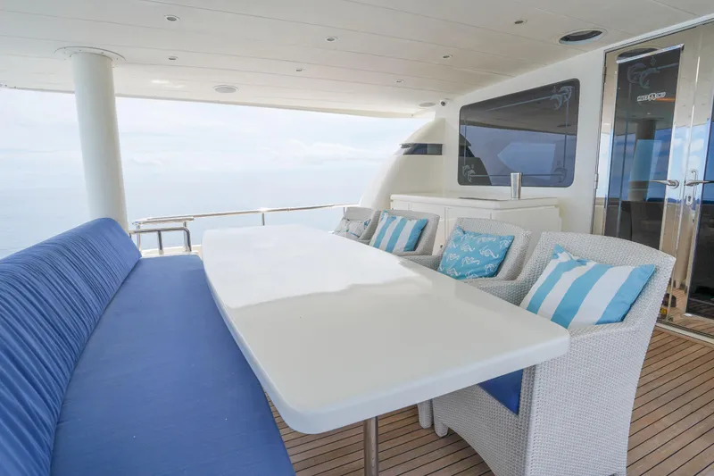 Slide: The Image of Luxurious outdoor seating on 2001 Monte Fino 82MY yacht with ocean view. - 11