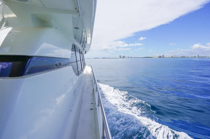 Slide: The Image of Monte Fino 82MY yacht cruising on open sea, 2001 model, clear blue sky. - 13