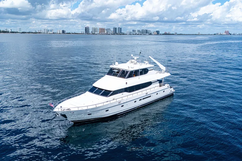 Slide: The Image of Luxurious 2001 Monte Fino 82MY yacht cruising on open water under a cloudy sky. - 2