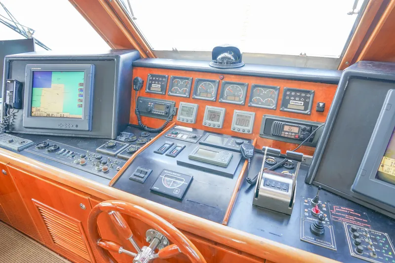 Slide: The Image of Luxurious interior of 2001 Monte Fino 82MY yacht with elegant wood finishes and spacious seating. - 28