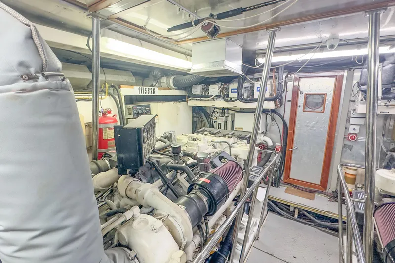 Slide: The Image of Engine room of 2001 Monte Fino 82MY yacht, featuring machinery and equipment. - 53