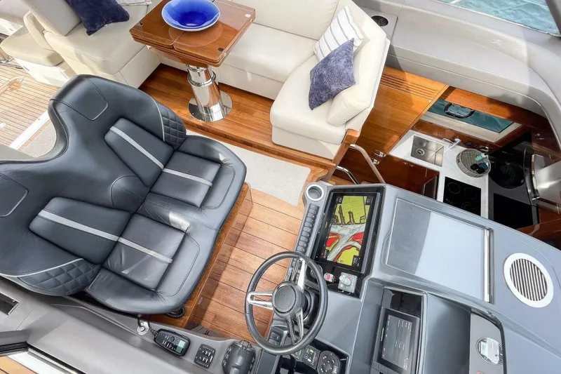 Slide: The Image of Luxurious interior of 2022 Princess V50 yacht with leather seating and modern navigation system. - 10