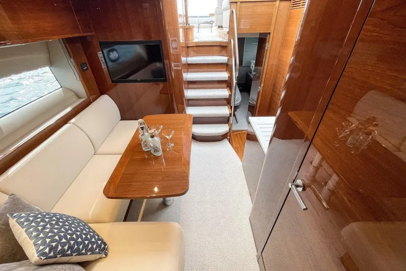 Slide: The Image of Luxurious interior of 2022 Princess V50 yacht with elegant seating and wooden finishes. - 22
