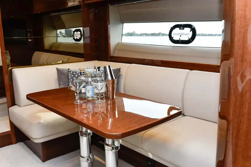 Slide: The Image of Luxurious interior of 2022 Princess V50 yacht with elegant seating and polished table. - 24