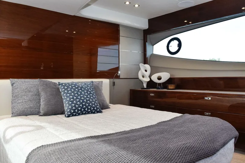 Slide: The Image of Luxurious 2022 Princess V50 yacht bedroom with elegant decor and modern furnishings. - 27