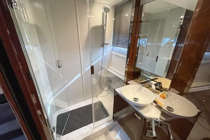 Slide: The Image of Luxurious bathroom in 2022 Princess V50 yacht with modern shower and dual sinks. - 29