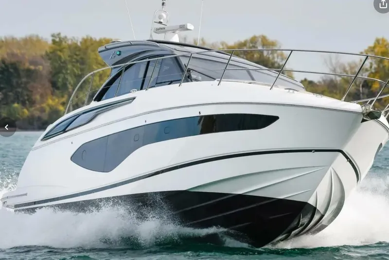 Slide: The Image of 2022 Princess V50 yacht cruising on water, showcasing sleek design and modern features. - 4