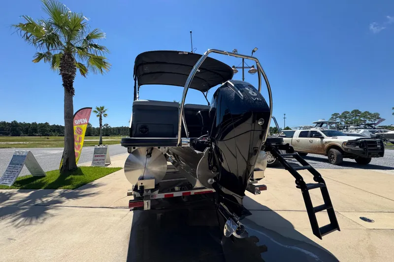 Slide: The Image of 2026 Bennington 22 MFB boat with powerful outboard motor on display. - 12
