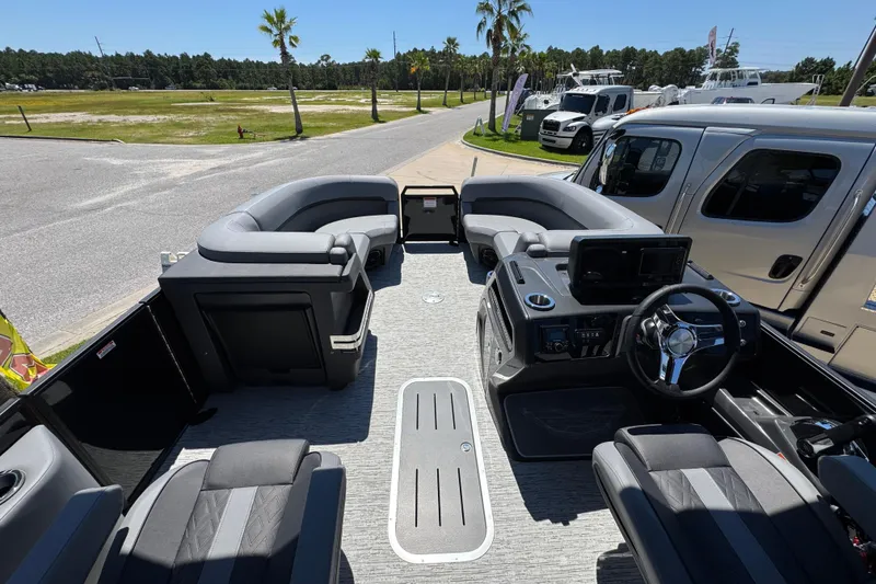 Slide: The Image of 2026 Bennington 22 MFB pontoon boat interior with modern seating and steering console. - 22